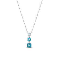 This Graduated Blue Topaz Diamond Necklace features a vertical arrangement of gemstones set in white gold. The stones increase in size from top to bottom, each separated by a small round diamond. Its clean lines and geometric shapes offer a modern, minimalist aesthetic with a touch of color. Modern Minimalist Aesthetic, Diamonds Direct, Minimalist Aesthetic, Round Diamond, Clean Lines, Blue Topaz, Modern Minimalist, Geometric Shapes, Round Diamonds