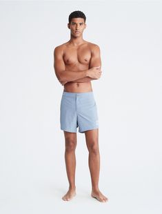 Made with a solid design, these swim shorts feature minimal styling. Created with slip pockets at both sides and a button closure. Finished with a CK monogram logo patch near the hem.  Material: 92% Repreve Polyester, 8% Spandex. Ck Monogram, Body Reference, A Button, Monogram Logo, Both Sides, Swim Shorts, Patch Logo, Fashion Illustration, Calvin Klein