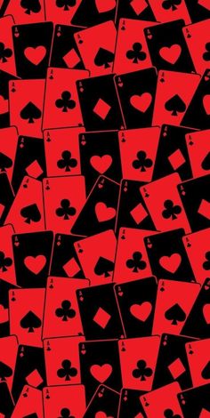 red and black playing cards with hearts on them