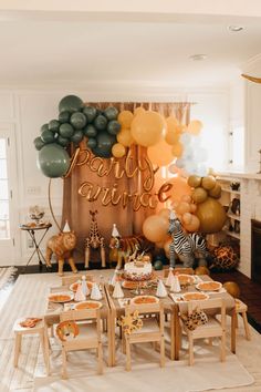 an animal themed party with balloons and decorations