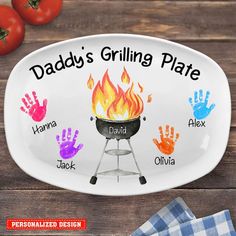 personalized grilling plate with hand and foot prints on it, including the name daddy's grilling plate