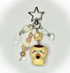 a key chain with an animal charm attached to it