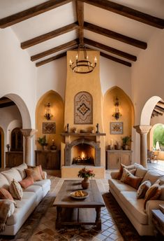 a living room with two couches and a fire place in it's center