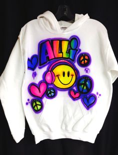 White Airbrushed Hooded Sweatshirt with artwork on the front. 50/50 blend. Small ( 6/8) Medium (10/12) Large (14/16) X-Large (18/20) Adult sizes also available. Sizes Small and Medium. *Sizes run small, It is recommended to size up. *Heat Pressed to preserve artwork* DEFAULT DESIGN IS THE PRIMARY PHOTO ON THE LISTING. If you would like what is shown on the first photo, you do not need to choose a design number. To add words, artwork or to select a different style of font to your design please co Custom Artwork Long Sleeve Hoodie For Streetwear, Casual Sweatshirt With Custom Artwork For Streetwear, Casual Hoodie With Custom Artwork For Streetwear, Fun Graphic Print Hoodie For Spring, White Hoodie Sweatshirt With Graffiti Print, White Graffiti Print Hoodie Sweatshirt, White Cotton Hoodie With Graffiti Print, Casual White Hoodie With Sublimation Print, White Casual Hoodie With Graphic Design