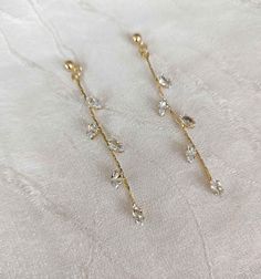 Romantic rhinestones dangle earrings for your special event. SY-2566 DETAILS -they measure about 7cm(2.75") long and .5cm(0.19") wide. -cubic zirconia, rose gold alloy NEED MORE HELP? I'm happy to provide advice or recommendations; just send me a message! SHOP MORE STYLES: https://www.etsy.com/shop/AdoraCoutureStore?ref=seller-platform-mcnav SHIPPING: EUROPE: 4 - 12 working days , outside EUROPE: 8 - 20 working days. For the fastest delivery, please select Express shipping during checkout. CANCE Anniversary Chandelier Dangle Earrings With Sparkling Stones, Anniversary Chandelier Earrings With Sparkling Stones, Dangle Rhinestone Bridal Earrings As Gift, Elegant Sparkling Crystal Dangle Earrings, Dangle Bridal Earrings With Rhinestones, Dainty Crystal Drop Earrings For Party, Dainty Dangle Linear Earrings For Party, Bridal Dangle Earrings With Rhinestones, Sparkling Dangle Chandelier Earrings For Anniversary