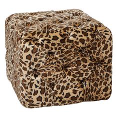 an animal print square ottoman with buttons on the front and back end, in brown