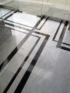 a marble floor with black and white lines on it