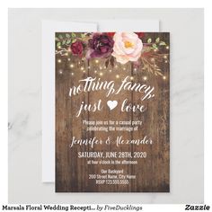 the rustic wedding reception card is shown with flowers and string lights on wooden planks