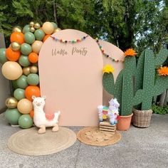 an outdoor party with balloons, decorations and a sign that says welcome party on it