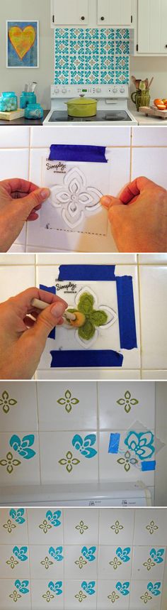 someone is using scissors to cut out some designs on the wall above the stove top