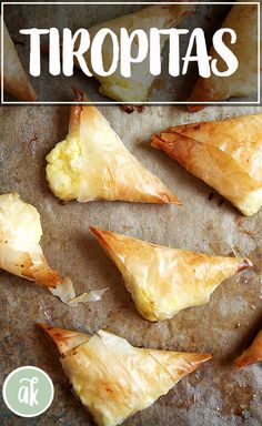 there are some food that is on the baking sheet and has been cut into triangles