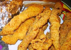 fried food on a plate with foil wrapper