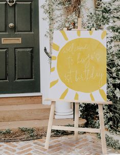 a yellow and white sign sitting in front of a door