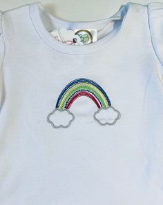 Custom embroidered rainbow shirt for little girls.  A name may also be added to these rainbow shirts. Choose your font choice and thread color if a name is to be added for your rainbow shirt. List these in the personalization section.  I apply tender touch to back of embroidery design as to not scratch your little one.  Wash in cold water inside out and line dry. Warm iron if needed.  I look forward to making something special for little one.  If you have any questions please feel free to message me. Playful Rainbow Cotton T-shirt, Playful Cotton Rainbow T-shirt, Playful Embroidered Cotton T-shirt, Cute Rainbow Cotton T-shirt, Cute Multicolor Embroidered Tops, Rainbow Shirts, Embroidered Rainbow, Rainbow Embroidery, Girl Rainbow