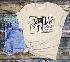 As our way of giving back, we are offering Carolina Strong T-shirts. A portion of proceeds from these shirts will be donated to a local organization to assist with storm clean up and restoration. These T-shirts are bella canvas, or tultex. They are designed to be lightweight. Giving Back, Clean Up, South Carolina, North Carolina, Bella Canvas, Tee Shirt, Colorful Shirts, Gender Neutral, Tee Shirts