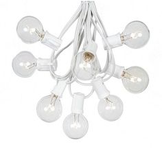 a white chandelier with many bulbs hanging from it's center and one light on each side