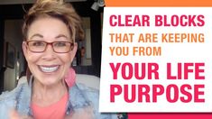 a woman holding up a sign with the words clear blocks that are keeping you from your life purpose