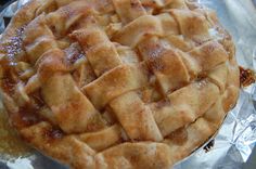 an apple pie sitting on top of aluminum foil