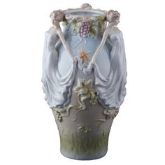 a white vase with an image of a woman holding grapes on it's face