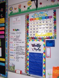 a bulletin board with calendars on it