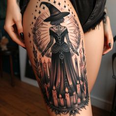 a woman's thigh with an image of a witch on it