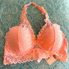 Beautiful Victoria’s Pink, Peach/Pink Color Lacy Padded Halter Bra, Nwt. Per The Attached Manufacturer Tag, The Bra Will Fit An A To C Cup. Note: Their Is A Small Mark On The Haltered Closure, But Other Than That, The Bra Is In Excellent Condition And Never Worn. This Bra Comes From A Non Smoking And Pet Free Home. Spring Pink Bra With Lace Trim, Pink Stretch Lace Bra, Peach Pink Color, Lace Bandeau Bra, Halter Bra, Lace Bandeau, Pink Bralette, Sleep Wear, C Cup