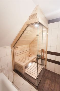 a bathroom with a wooden sauna in the corner