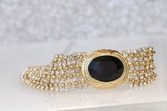 BLACK GOLD BRACELET, Elegant Bracelet, Mother Of The Brides, Wedding Chunky Bracelet, Gold And Black, Formal Jewelry For Women Details of bracelet: Metal: 24K Gold Plated , silver plated or rose gold plated - Nickel Free Gemstone: crystal Length: 3.2 Inch Width: 6.8 Inch if you need other size please write in note The bracelet will be packed in a gift box. , MATCHING EARRINGS CLICK HERE: https://www.etsy.com/listing/570827375/black-tassel-earrings-?ga_search_query=black%2Btassel%2Bearrings&r Luxury Black Bracelets For Wedding, Party Gold Bracelet With Hand-set Stones, Glamorous Gold Jewelry For Gala, Gold Jewel-encrusted Bracelets For Evening, Gold Jeweled Bracelets For Evening, Gold Bracelets With Jewels For Evening, Elegant Gold Bracelet With 17 Jewels For Parties, Gold Jubilee Bracelet For Evening, Yellow Gold Jeweled Bracelets For Wedding