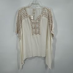 Size: L/Xl Length: 25” Pit To Pit: 30” Lightweight Poncho Blouse From Chicos Perfect For A Fall/Autumn Outing Or Fans Of Boho Style. Features A White Blouse With Tan Embroidered Detailing And Silver Mirror Buttons. This Blouse Has A Flowy, Comfortable Fit Like A Poncho. Arrives To You In Excellent, New Condition With Original Tags! - 100% Rayon - Lightweight - Scoop Neck Down Into A V - Embroidered Pattern Down Front And Sleeves - Poncho, Flowy Fit Be Sure To Check Out My Other Chicos Listings A Flowy White Top For Beach Cover-up, Flowy Poncho With Batwing Sleeves, White Poncho For Spring Beach Cover-up, White Relaxed Fit Tops For Festival, Bohemian Batwing Sleeve Poncho For Spring, Off White Bohemian Short Sleeve Top, Bohemian Off White Short Sleeve Tops, White Flowy Top For Beach Cover-up, Oversized Bohemian Beige Blouse