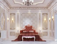 an elegant bedroom with white walls and chandelier hanging from the ceiling, along with a red couch