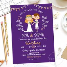 a wedding card with the bride and groom holding hands on top of a desk next to a keyboard