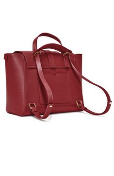 Crafted from Italian leather with a secure top zipper and flap closure, the original Maestra Bag can fit a 13" laptop in its  padded sleeve, a 15" laptop in the middle, and essentials in 7 pockets. Best of all, this convertible handbag can be worn four ways: as a backpack, crossbody, satchel or tote. Wear 4 Ways: Backpack, Crossbody, Satchel, Tote Scratch & water-resistant Italian Pebbled leather What Fits: Up to 15" laptop; padded sleeve fits 13" laptop, 6 pouch pockets and 1 zip pocket for ess Senreve Maestra, Convertible Handbag, Crossbody Satchel, Satchel Tote, Nordstrom Store, Italian Leather, Pebbled Leather, Pocket Pouch, Convertible