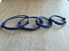 "These lovely bracelets were made using 2mm blue waxed cord. Designed for everyday wear. All the bracelets are adjustable. The adult bracelet opens to around 10\" and closes to 6\". The kid bracelet opens to around 7\" and closes to 5\". A great idea for a family gift. Please feel free to contact me if you have any questions For more Family Bracelets: https://www.etsy.com/shop/Fanfarria?section_id=17007792&ref=shopsection_leftnav_4 Check all Fanfarria's products: https://www.etsy.com/shop/fa Adjustable Blue Leather Bracelet As Gift, Adjustable Blue Leather Bracelet Gift, Adjustable Blue Leather Bracelet, Adjustable Blue Leather Bracelet For Everyday, Adjustable Blue Friendship Bracelet, Adjustable Blue Friendship Bracelets With Sliding Knot, Blue Braided Bracelet With Sliding Knot As Gift, Blue Adjustable Waxed Cord Jewelry, Adjustable Blue Waxed Cord Friendship Bracelets