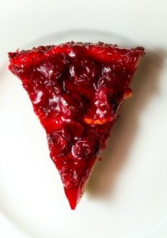 a slice of cherry pie on a white plate