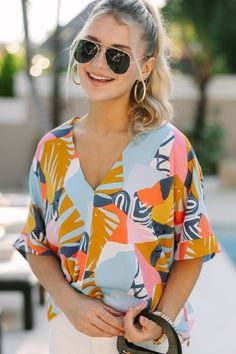 This oversized top is so comfy and light! It honestly couldn't be more perfect for the summer! Especially if you have a beach vacay coming up! This tropical abstract print top is going to look so good with white shorts for a stroll on the beach!
V-neckline 
Short sleeves
Tropical abstract print
No stretch
Poppy is wearing the small. Tropical Abstract, Beach Vacay, Yellow Abstract, Mint Julep Boutique, Oversized Top, Model Fits, Print Top, Mustard Yellow, Abstract Print