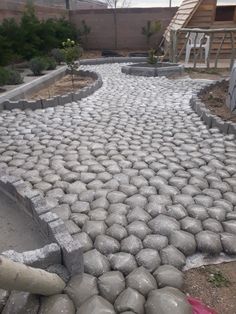 a stone path made out of rocks and cement