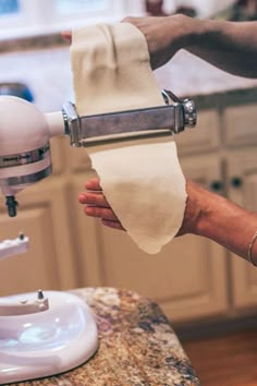 a person is using a hand mixer to make something