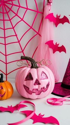 halloween decorations with pink and orange pumpkins