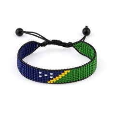 Celebrate the vibrant culture of the Solomon Islands with this stylish and adjustable beaded bracelet. Crafted with meticulous attention to detail, this boho-style rope bracelet features a stunning pattern inspired by the iconic Solomon Islands flag. Perfect for both women and men, this accessory is a versatile addition to any outfit. The durable thread string construction ensures long-lasting wear, while the adjustable design allows for a comfortable and customized fit on your wrist. Whether youre a proud native or simply appreciate the beauty of diverse cultures, this bracelet is a must-have for your jewelry collection. Embrace the spirit of the Solomon Islands and add a touch of island charm to your everyday look. Solomon Islands Flag, Adjustable Beaded Bracelet, Solomon Islands, Bracelet For Women, Boho Style, Rope Bracelet, Boho Fashion