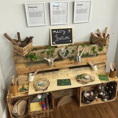 a wooden bench with pots, pans and other items on it in a room