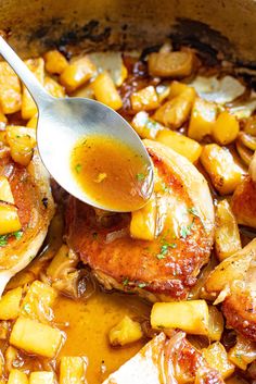 a close up of food in a pan with a spoon on top of the dish