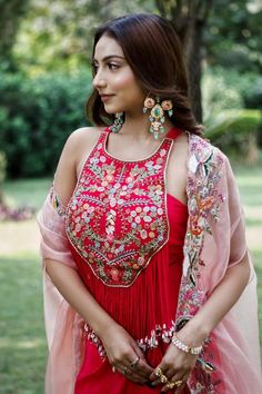 Fuchsia pink dabka and thread embroidered blouse with tassels. Paired with a dhoti skirt and a contrast peach embroidered cape. - Aza Fashions Pink Embellished Blouse With Traditional Drape, Pink Embroidered Fabric With Traditional Drape Dupatta, Festive Hand-embellished Traditional Drape Blouse, Diwali Embroidered Draped Lehenga, Pink Sleeveless Dresses With Tassels, Pink Sleeveless Bohemian Sets, Pink Embroidered Top With Traditional Drape, Pink Sleeveless Dress With Tassels, Pink Party Sets With Tassels