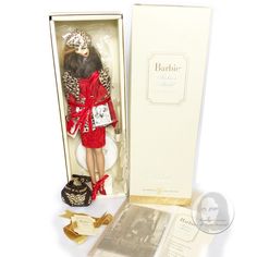 a doll in a box with its contents