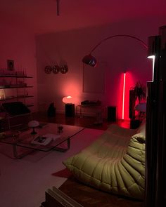 a living room filled with furniture and red lights