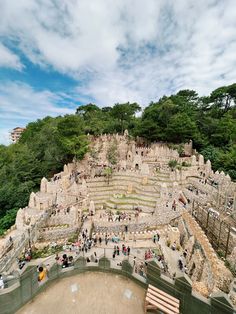 an aerial view of people walking around the ruins