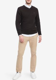 Amp up your style with this sweater from Tommy Hilfiger. Wear it on its own for a casual look or layer it over a collared shirt for a more elevated look. | Tommy Hilfiger Men's Essential V-Neck Sweater, Black, X-Large Mens Essentials, Collared Shirt, Tommy Hilfiger Man, Sweater Black, Casual Look, V Neck Sweater, Wear It, Vneck Sweater, Neck Sweater