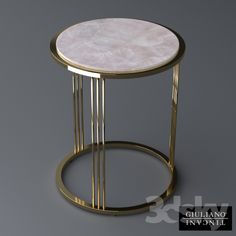 a white marble top table with gold metal frame and round base, on a grey background