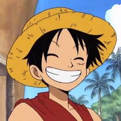 one piece is smiling and wearing a straw hat