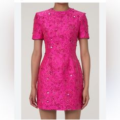 A Feast For The Eyes, This Statement Floral Dress Stands Out Among Our Hot Pink Dresses. It Features A Round Neck And Short Sleeves, Cinched At The Waist With A Slightly Flared Skirt And A Discreet Back Zipper. The Exquisite Cotton Blend Jacquard Fabric, Enhanced With Lurex, Lends A Luxurious Golden Sheen To The Floral Patterns, Accentuated By Sparkling Sequins For A Cute Yet Dazzling Touch. Perfect With A Blazer, This Meticulously Tailored Short Dress From Our Boutique Is Ideal For Elegant Dinn Pink Jacquard Dress, Festive Party Dresses In Jacquard Material, Festive Party Dress In Jacquard, Festive Jacquard Party Dress, Glamorous Fitted Jacquard Dress, Silk Sheath Evening Dress For Party, Glamorous Jacquard Party Dresses, Glamorous Jacquard Dress, Glamorous Jacquard Dress For Formal Occasions