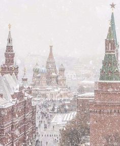 an aerial view of red square and the kreme tower during a snow storm